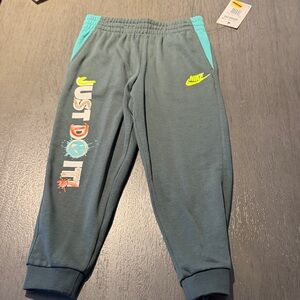 Nike Kids Teal Joggers with Neon Yellow Logo